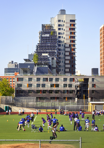 Once a  former brownfield site, the triangular lot of Via Verde is next to the South Bronx High School: and its adjacent field south of the development.  Photograph © David Sundberg/ESTO
